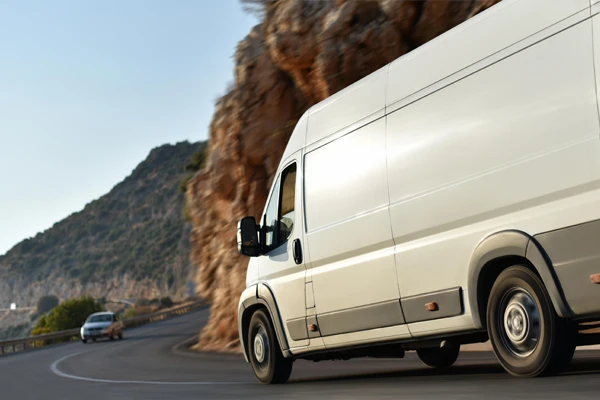 White sprinter van on a canyon drive 
